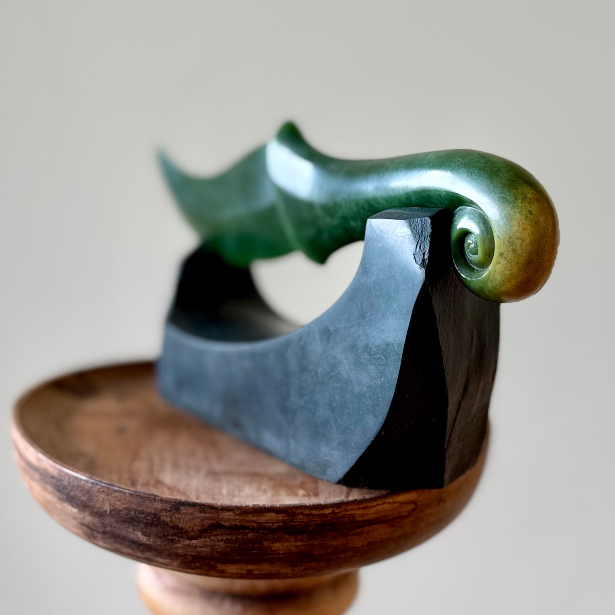 Hand carved large New Zealand Flower Jade knife with koru carving displayed in a Argillite stone stand sculpture. Hand carved here in New Zealand by Ric Moor. This is a 'one only' sculpture, a beautiful display piece.