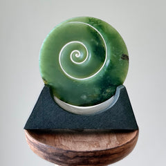 Hand carved large New Zealand Inanga Jade Koru with Greywacke stand sculpture. Hand carved here in New Zealand by Ric Moor. This is a 'one only' sculpture, a beautiful display piece.