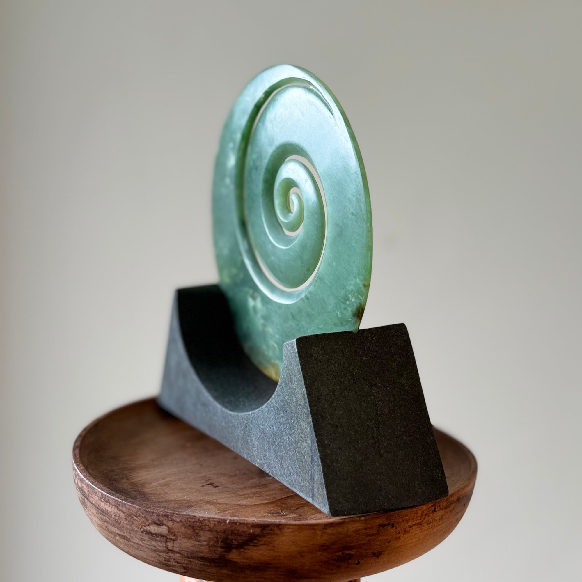 Hand carved large New Zealand Inanga Jade Koru with Greywacke stand sculpture. Hand carved here in New Zealand by Ric Moor. This is a 'one only' sculpture, a beautiful display piece.