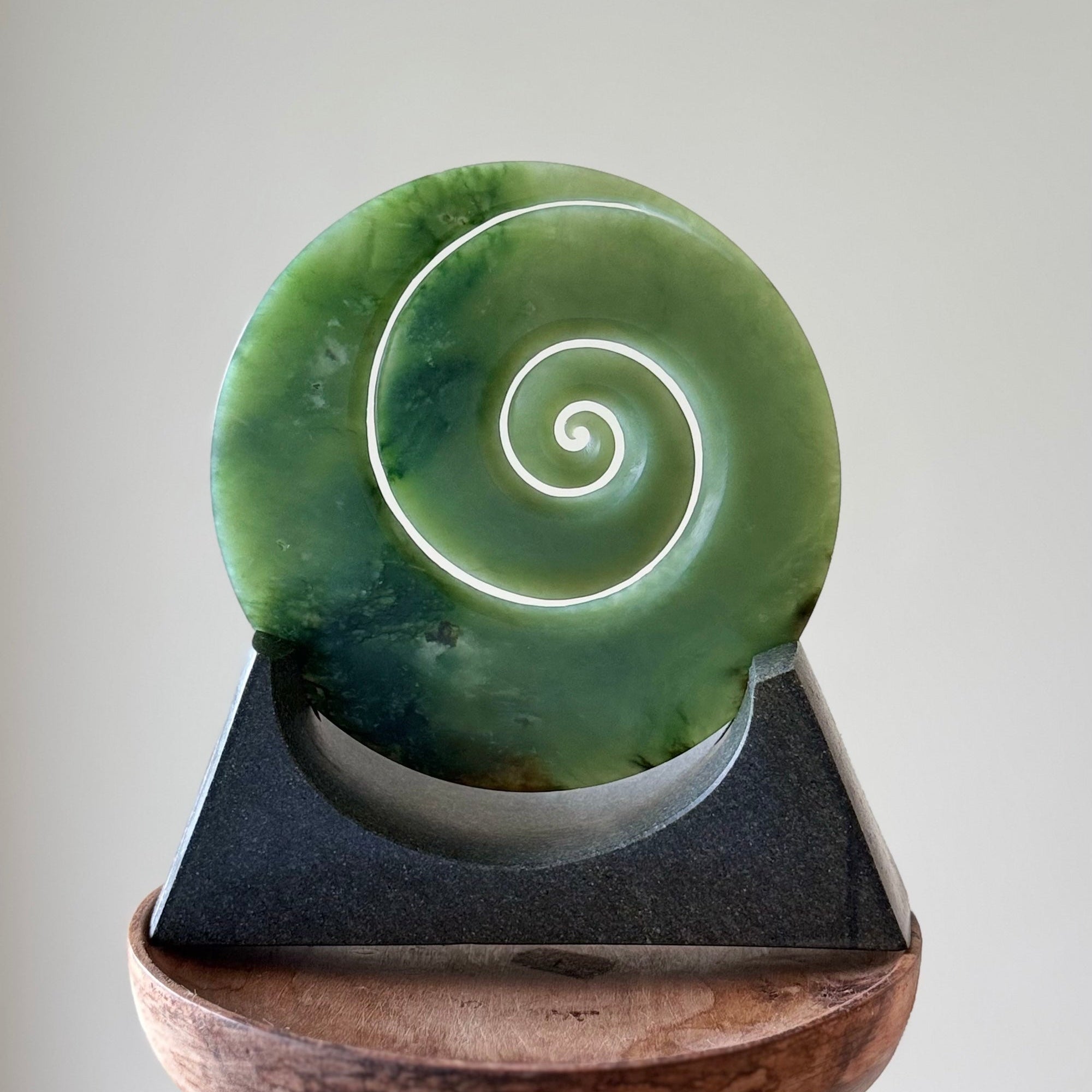 Hand carved large New Zealand Inanga Jade Koru with Greywacke stand sculpture. Hand carved here in New Zealand by Ric Moor. This is a 'one only' sculpture, a beautiful display piece.