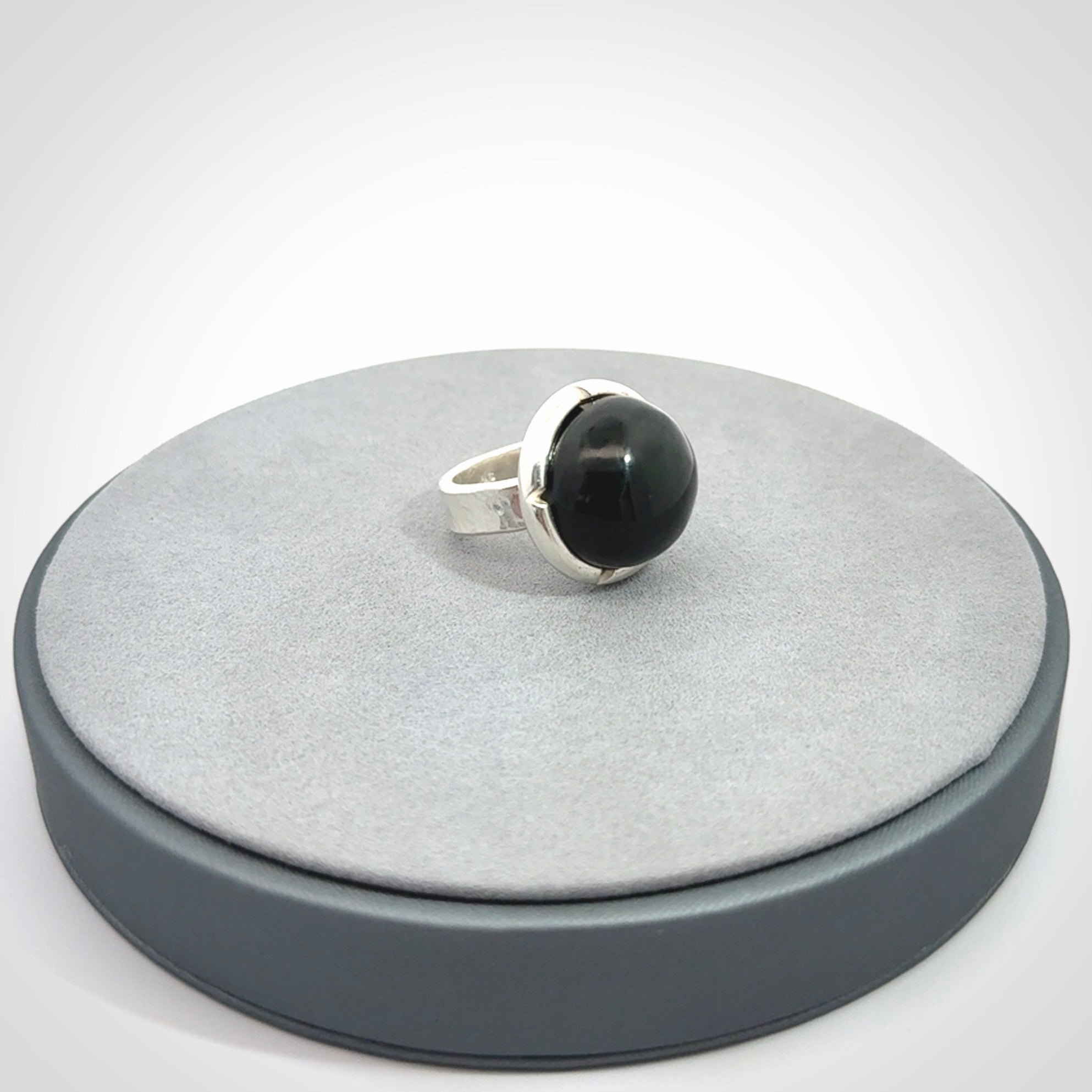 This is a handcrafted New Zealand Pounamu, Jade and sterling silver ring. 