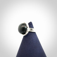 This is a handcrafted New Zealand Pounamu, Jade and sterling silver ring. 