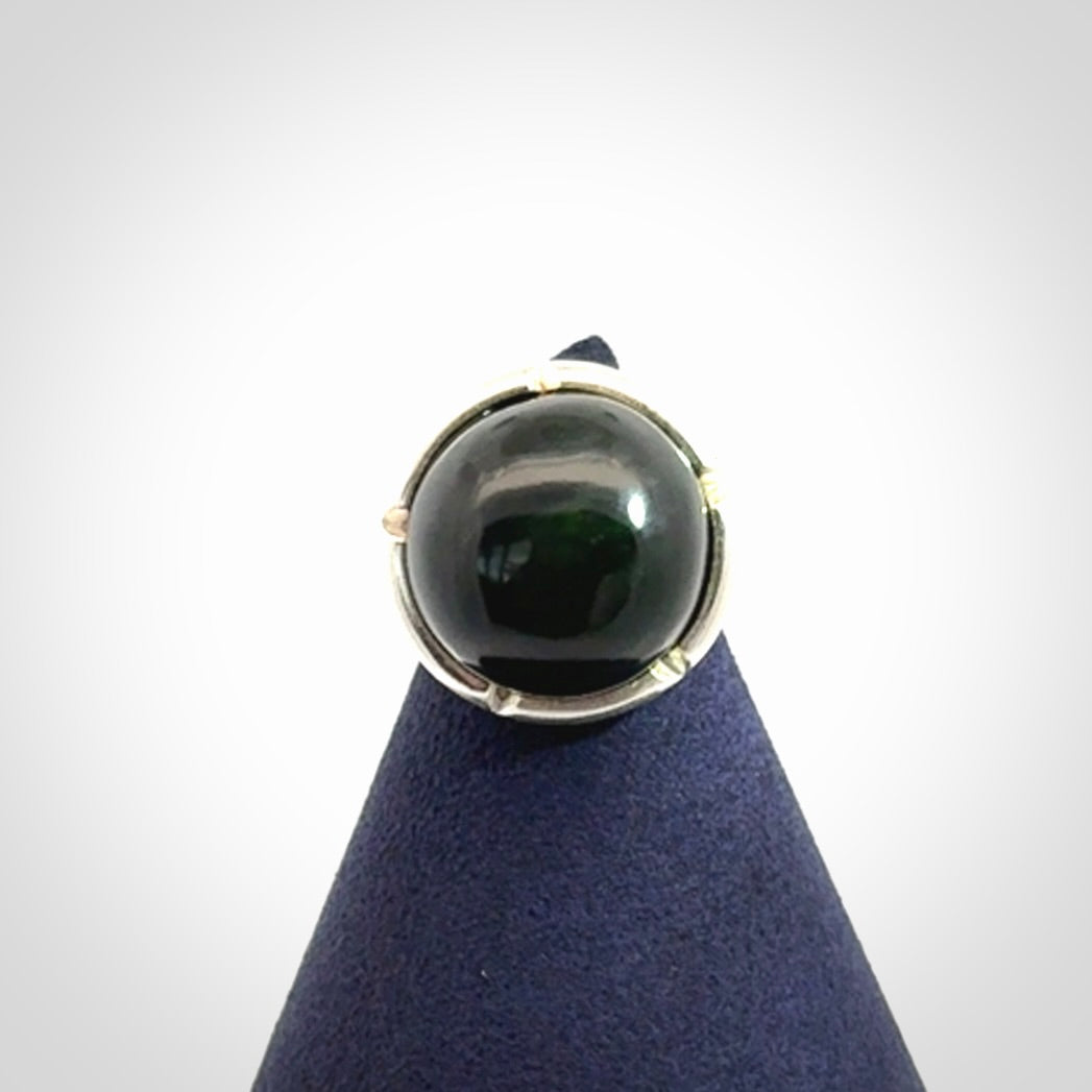 This is a handcrafted New Zealand Pounamu, Jade and sterling silver ring. 