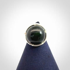 This is a handcrafted New Zealand Pounamu, Jade and sterling silver ring. 