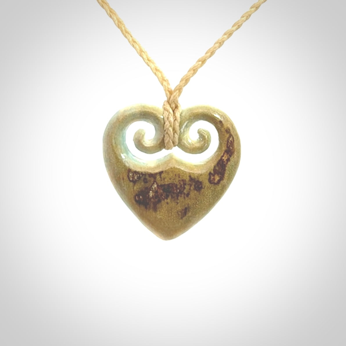 Hand carved heart pendant. Hand made from woolly mammoth tusk. Hand made jewellery for sale online. Rare and unique handmade jewellery. Made by NZ Pacific.