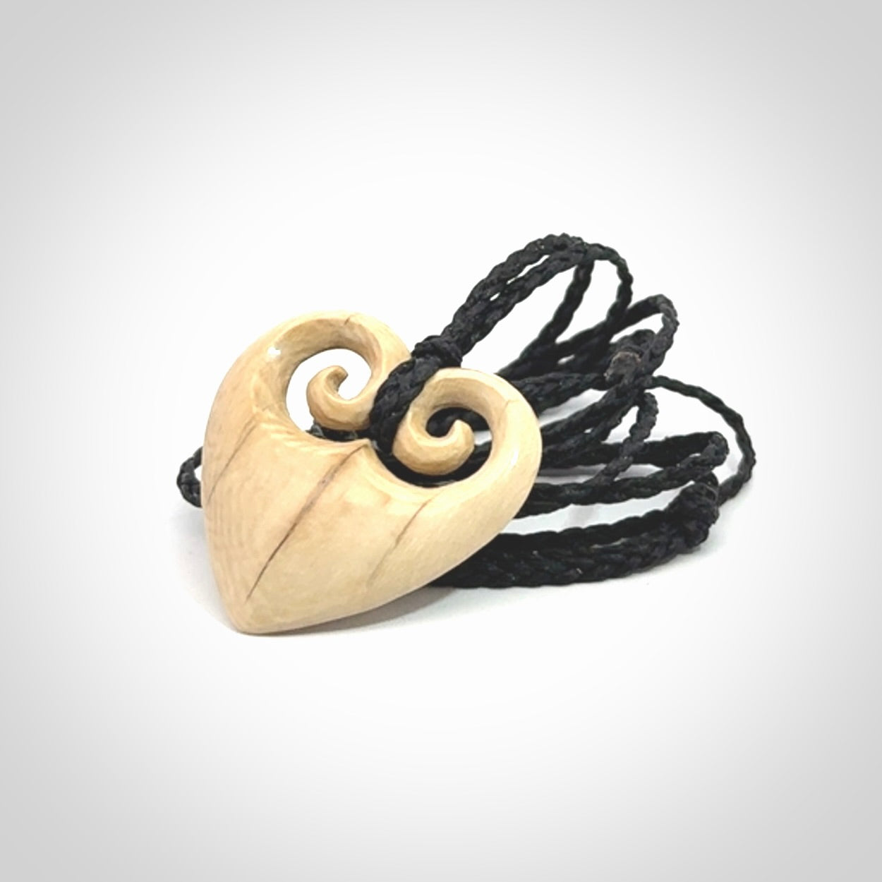 Hand carved heart pendant. Hand made from woolly mammoth tusk. Hand made jewellery for sale online. Rare and unique handmade jewellery. Made by NZ Pacific.