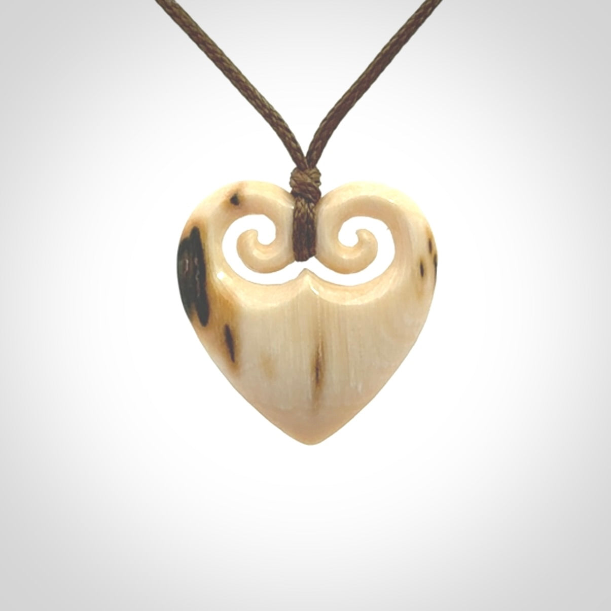 Hand carved heart pendant. Hand made from woolly mammoth tusk. Hand made jewellery for sale online. Rare and unique handmade jewellery. Made by NZ Pacific.