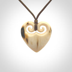 Hand carved heart pendant. Hand made from woolly mammoth tusk. Hand made jewellery for sale online. Rare and unique handmade jewellery. Made by NZ Pacific.