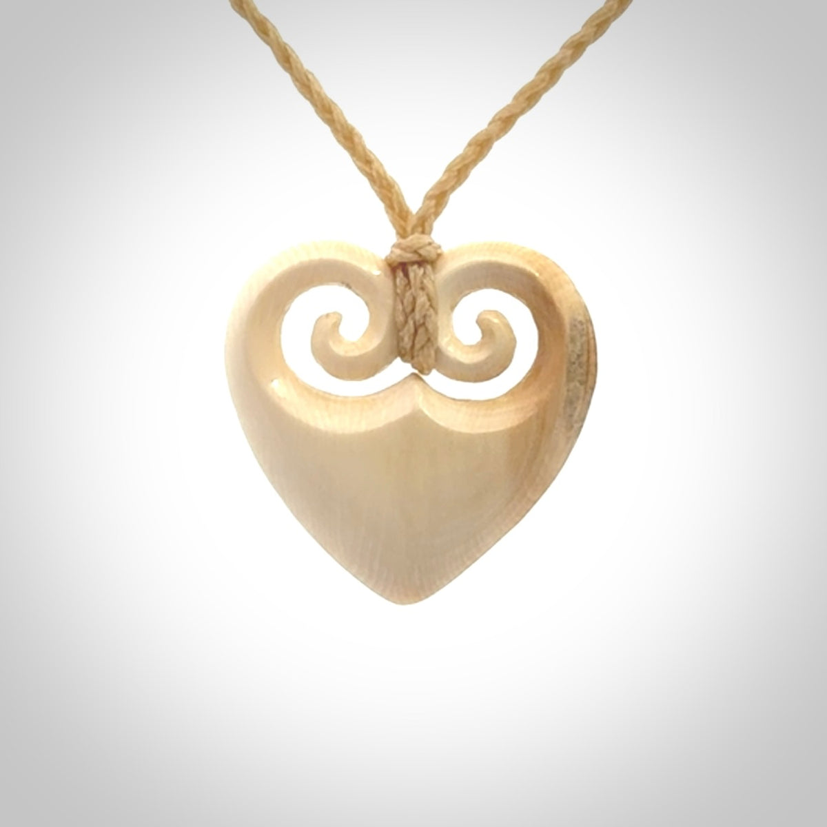 Hand carved heart pendant. Hand made from woolly mammoth tusk. Hand made jewellery for sale online. Rare and unique handmade jewellery. Made by NZ Pacific.