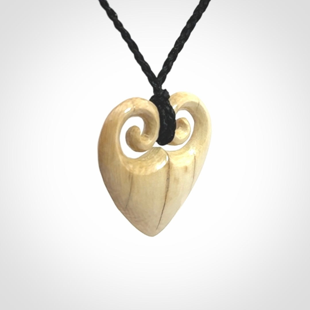 Hand carved heart pendant. Hand made from woolly mammoth tusk. Hand made jewellery for sale online. Rare and unique handmade jewellery. Made by NZ Pacific.