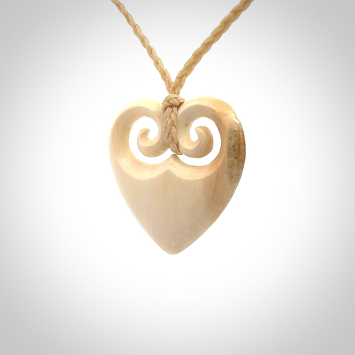 Hand carved heart pendant. Hand made from woolly mammoth tusk. Hand made jewellery for sale online. Rare and unique handmade jewellery. Made by NZ Pacific.