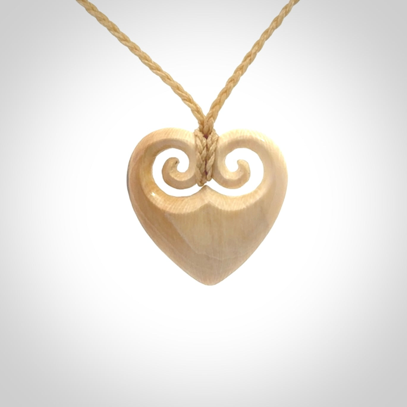 Hand carved heart pendant. Hand made from woolly mammoth tusk. Hand made jewellery for sale online. Rare and unique handmade jewellery. Made by NZ Pacific.