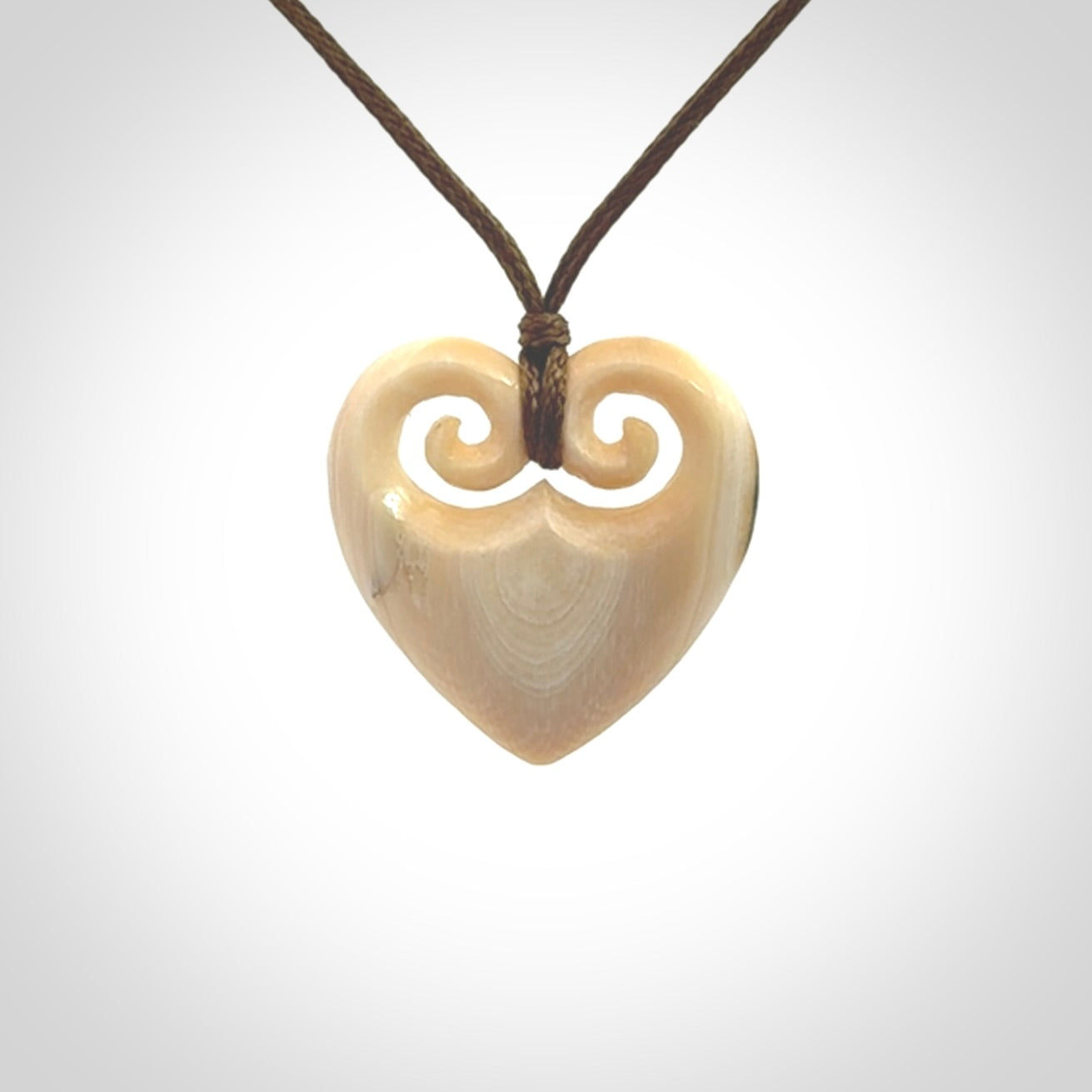 Hand carved heart pendant. Hand made from woolly mammoth tusk. Hand made jewellery for sale online. Rare and unique handmade jewellery. Made by NZ Pacific.