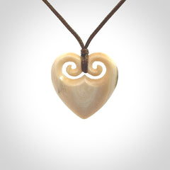 Hand carved heart pendant. Hand made from woolly mammoth tusk. Hand made jewellery for sale online. Rare and unique handmade jewellery. Made by NZ Pacific.