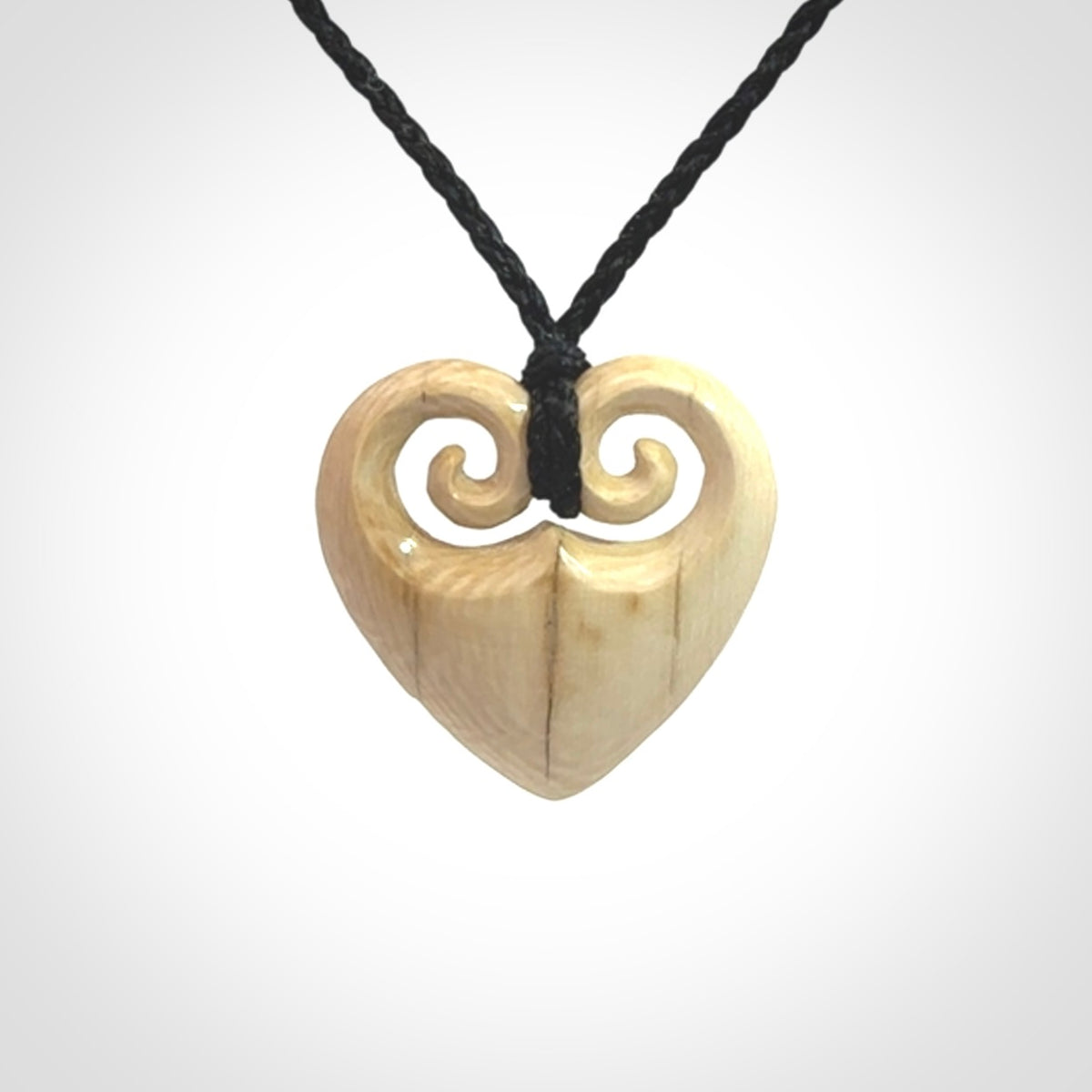 Hand carved heart pendant. Hand made from woolly mammoth tusk. Hand made jewellery for sale online. Rare and unique handmade jewellery. Made by NZ Pacific.
