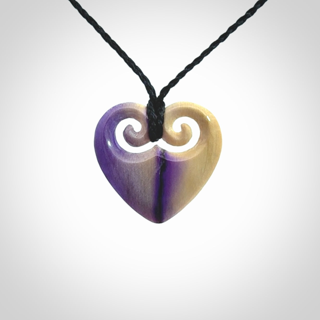 Hand carved heart pendant. Hand made from woolly mammoth tusk. Hand made jewellery for sale online. Rare and unique handmade jewellery. Made by NZ Pacific.