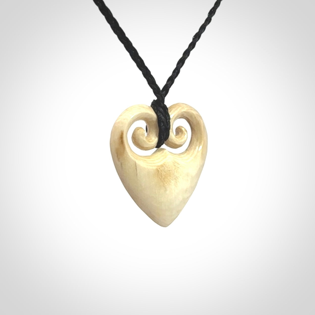 Hand carved heart pendant. Hand made from woolly mammoth tusk. Hand made jewellery for sale online. Rare and unique handmade jewellery. Made by NZ Pacific.