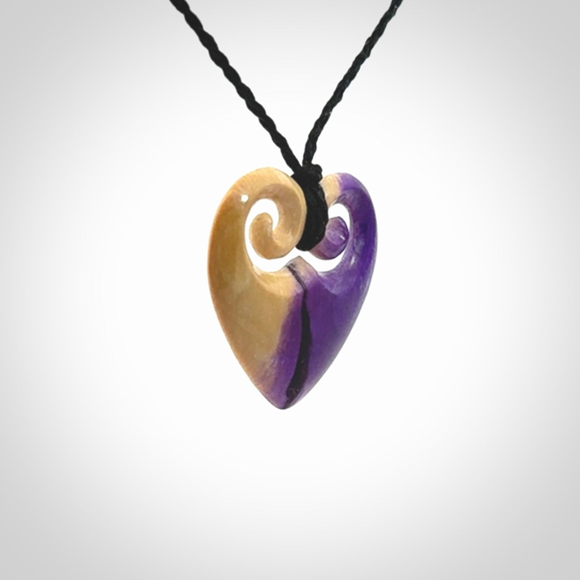 Hand carved heart pendant. Hand made from woolly mammoth tusk. Hand made jewellery for sale online. Rare and unique handmade jewellery. Made by NZ Pacific.