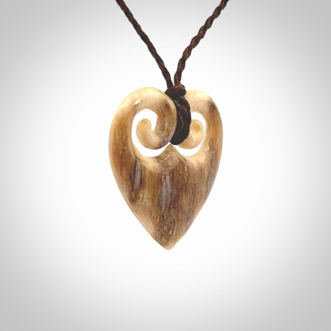 Hand carved heart pendant. Hand made from woolly mammoth tusk. Hand made jewellery for sale online. Rare and unique handmade jewellery. Made by NZ Pacific.