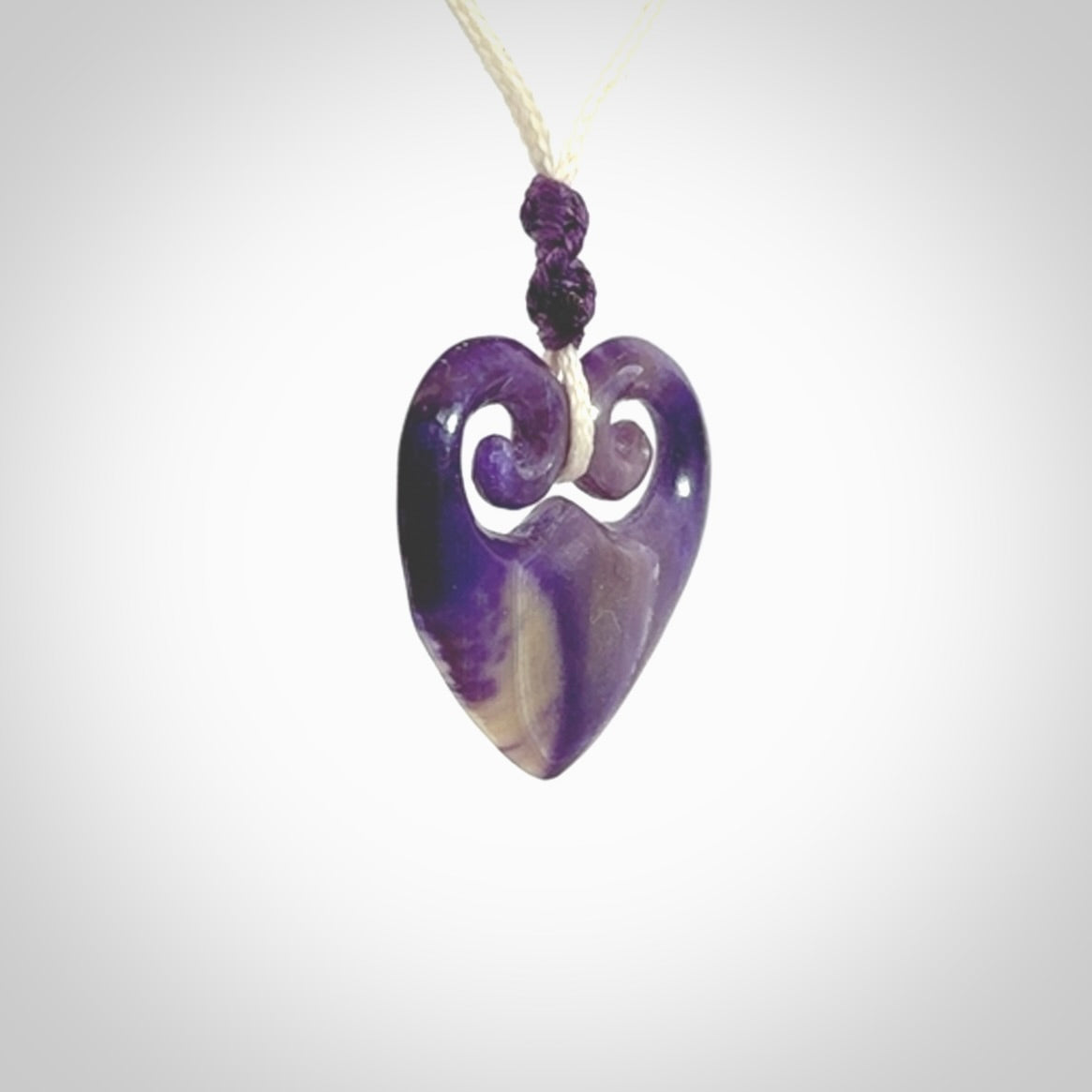 Hand carved heart pendant. Hand made from woolly mammoth tusk. Hand made jewellery for sale online. Rare and unique handmade jewellery. Made by NZ Pacific.