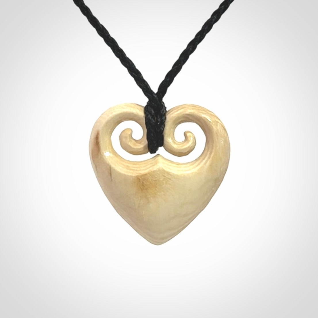 Hand carved heart pendant. Hand made from woolly mammoth tusk. Hand made jewellery for sale online. Rare and unique handmade jewellery. Made by NZ Pacific.