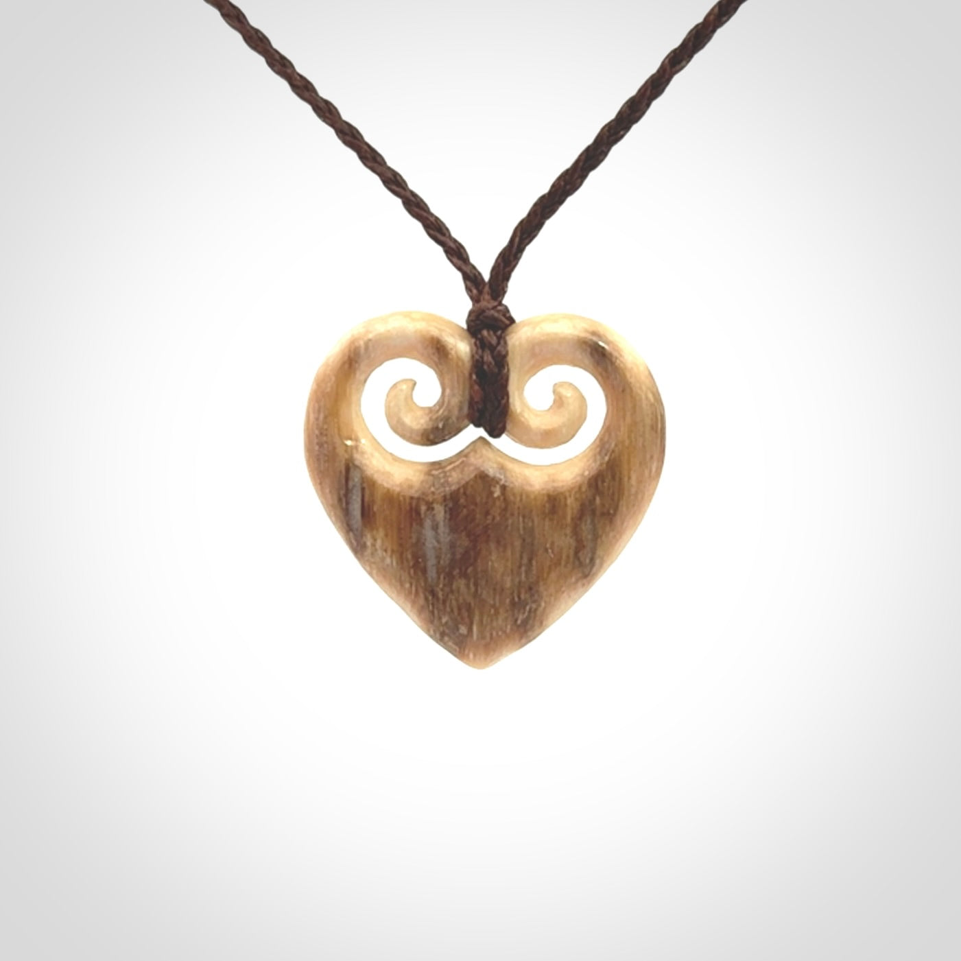 Hand carved heart pendant. Hand made from woolly mammoth tusk. Hand made jewellery for sale online. Rare and unique handmade jewellery. Made by NZ Pacific.
