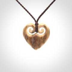 Hand carved heart pendant. Hand made from woolly mammoth tusk. Hand made jewellery for sale online. Rare and unique handmade jewellery. Made by NZ Pacific.
