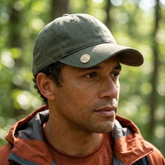Man wearing bone pin on his cap