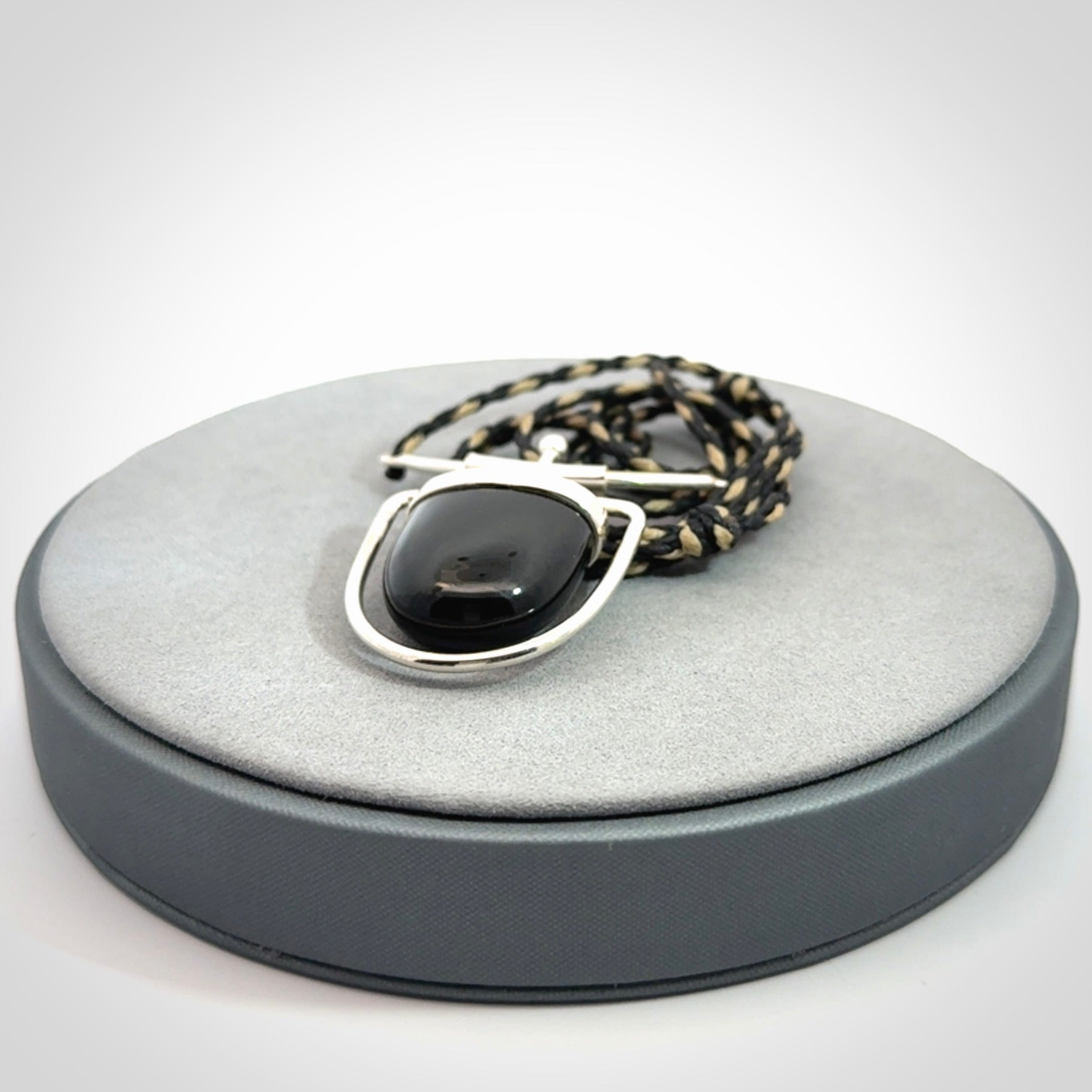 Black jade and silver pendant