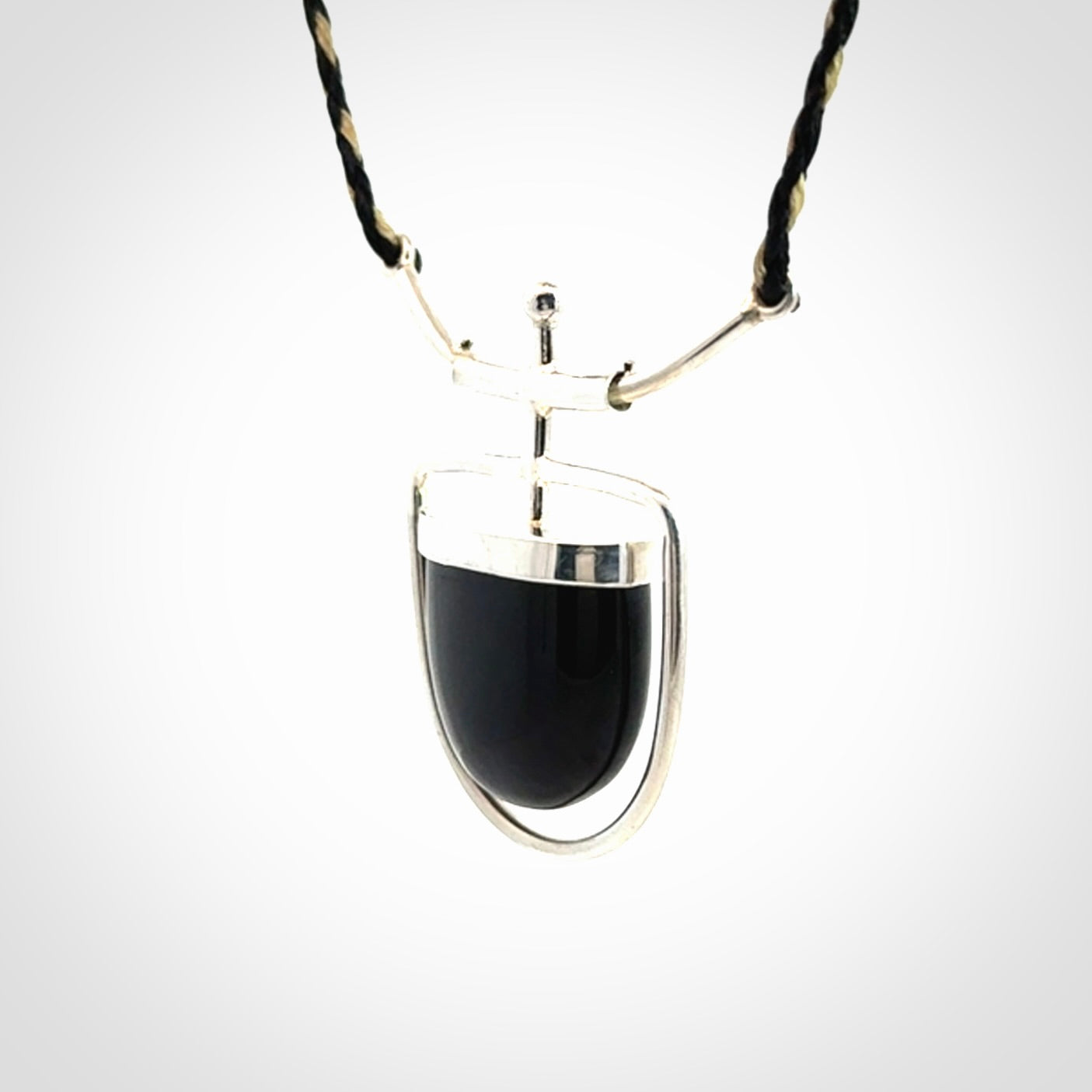 Black jade and silver pendant