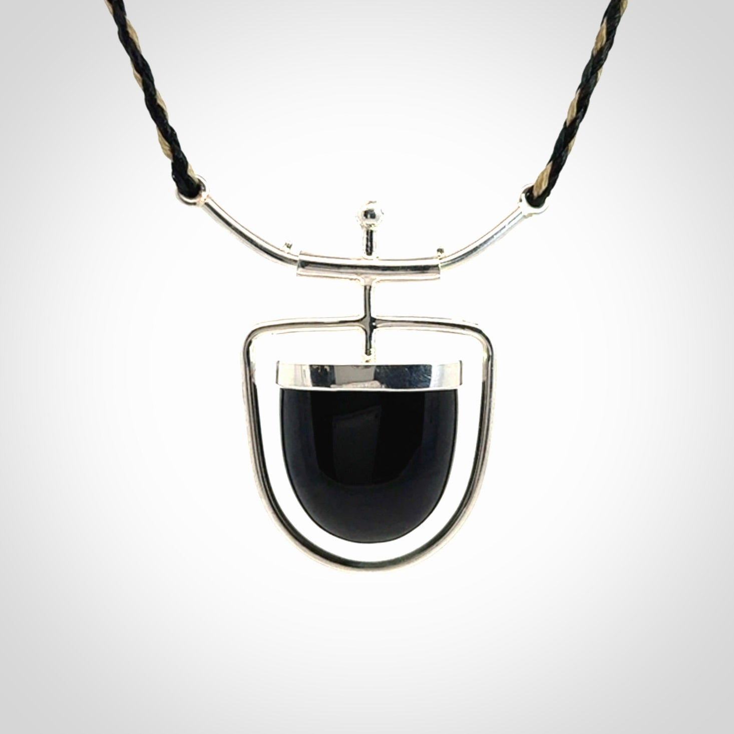 Black jade and silver pendant