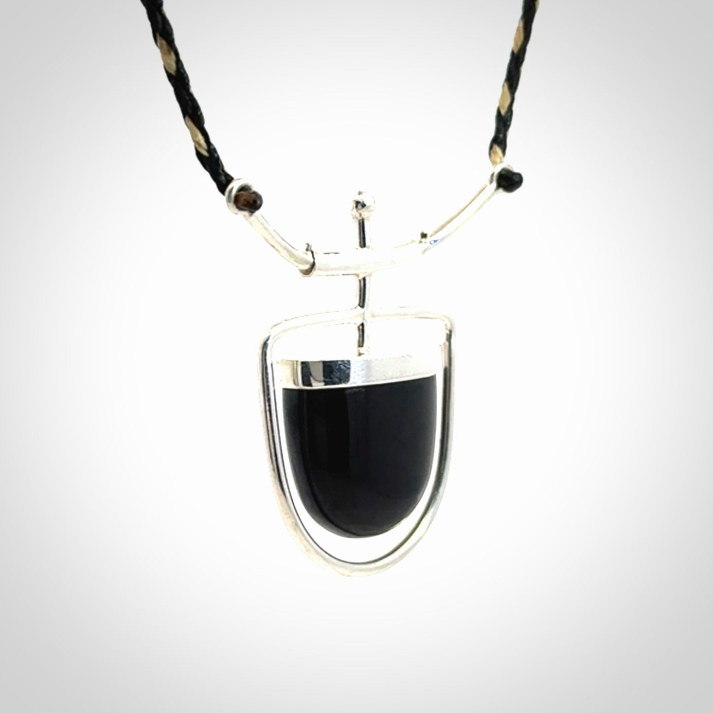 Black jade and silver pendant