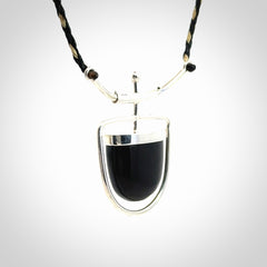 Black jade and silver pendant