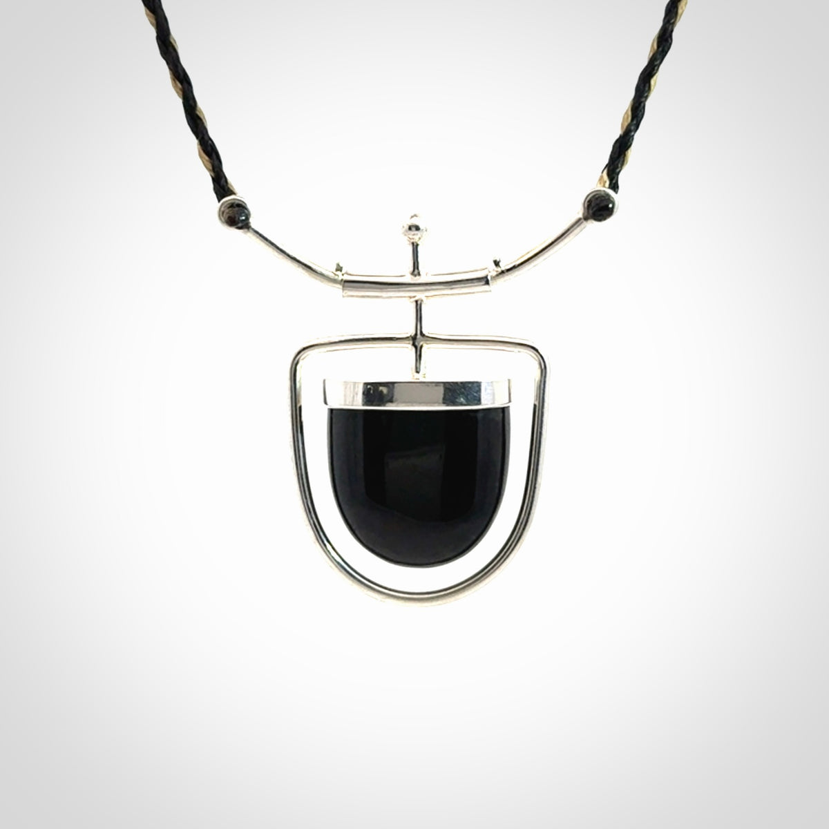 Black jade and silver pendant