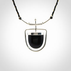 Black jade and silver pendant