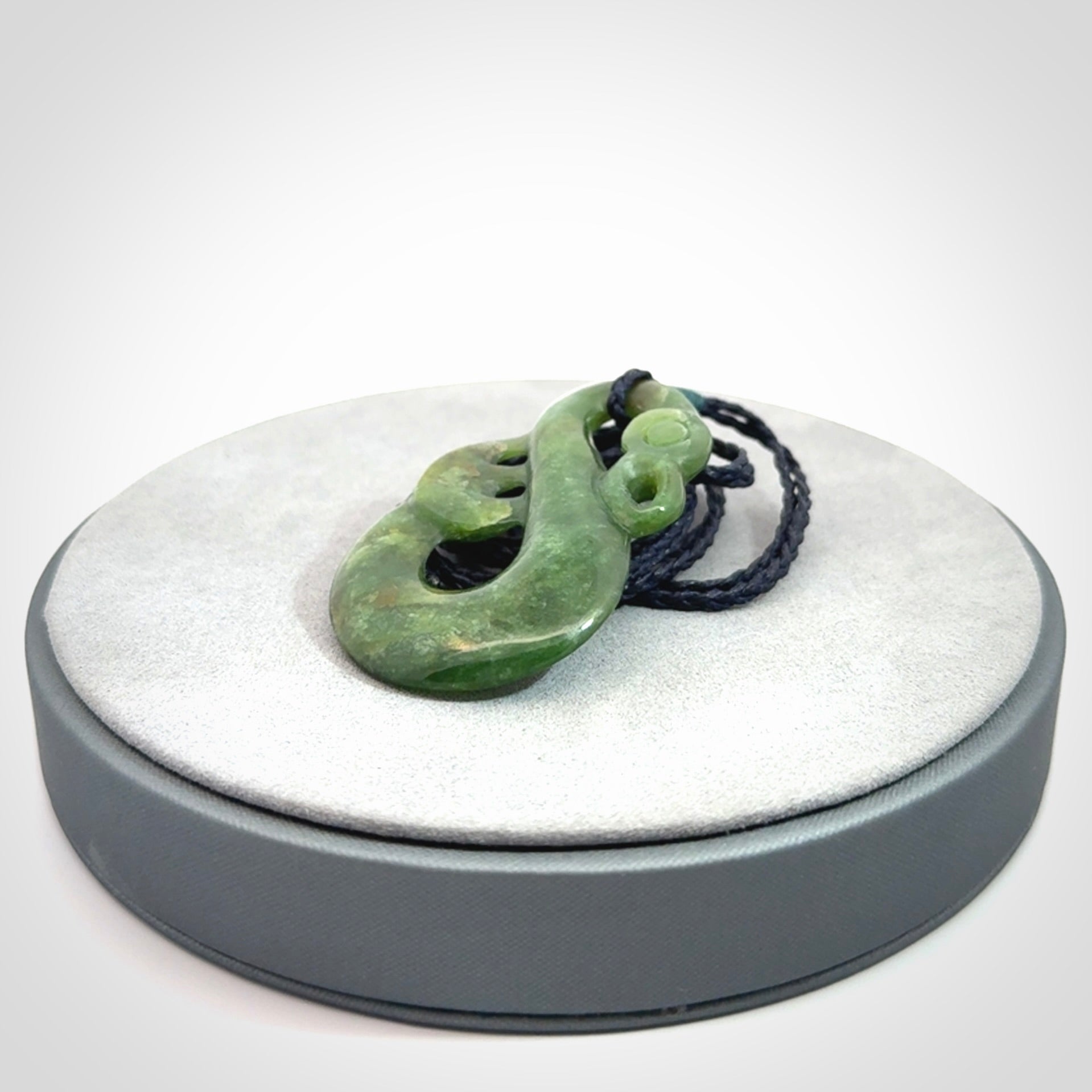 Hand carved New Zealand Jade manaia pendant. Hand made polished Manaia necklace for men and women.