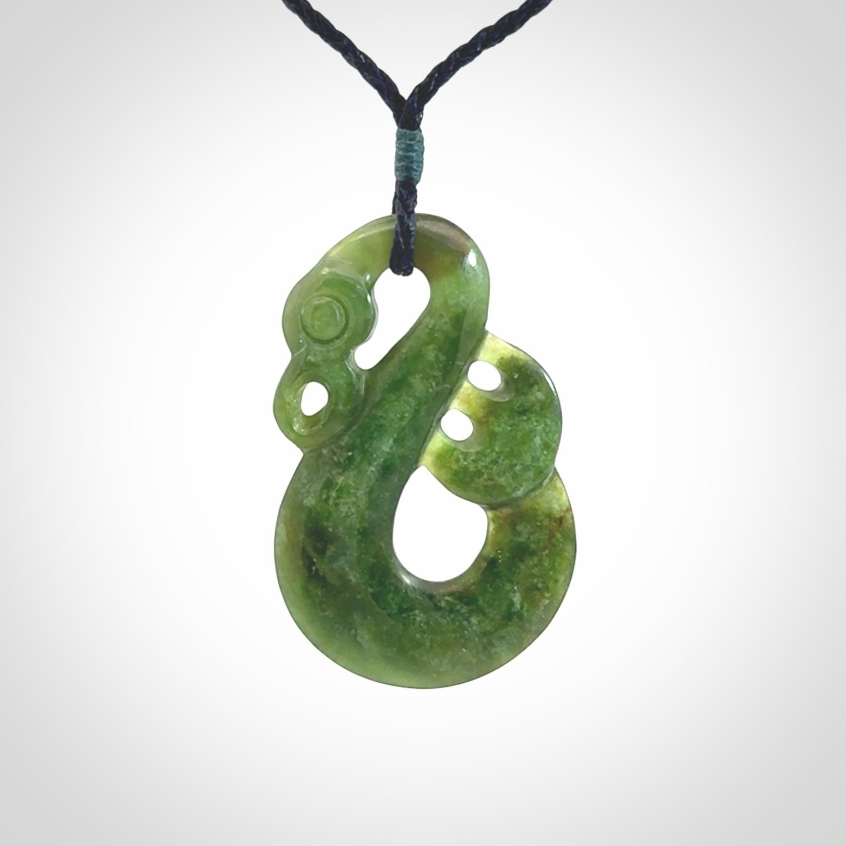 Hand carved New Zealand Jade manaia pendant. Hand made polished Manaia necklace for men and women.