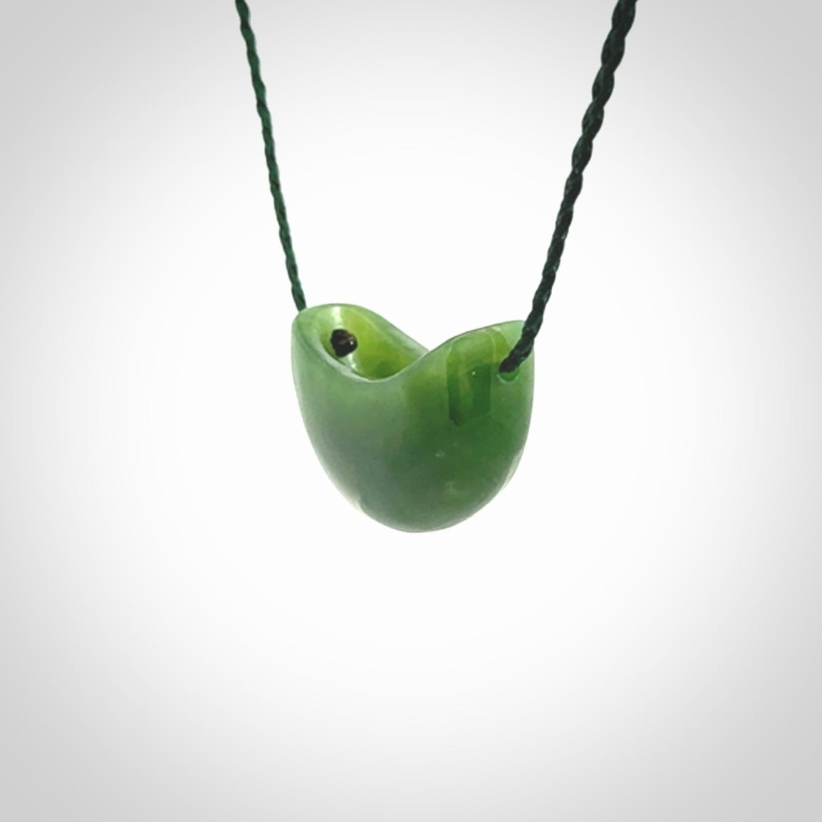 Hand carved jade kete pendant. Kete hand made in British Columbian Jade with adjustable cord. Delivered with Express Courier.