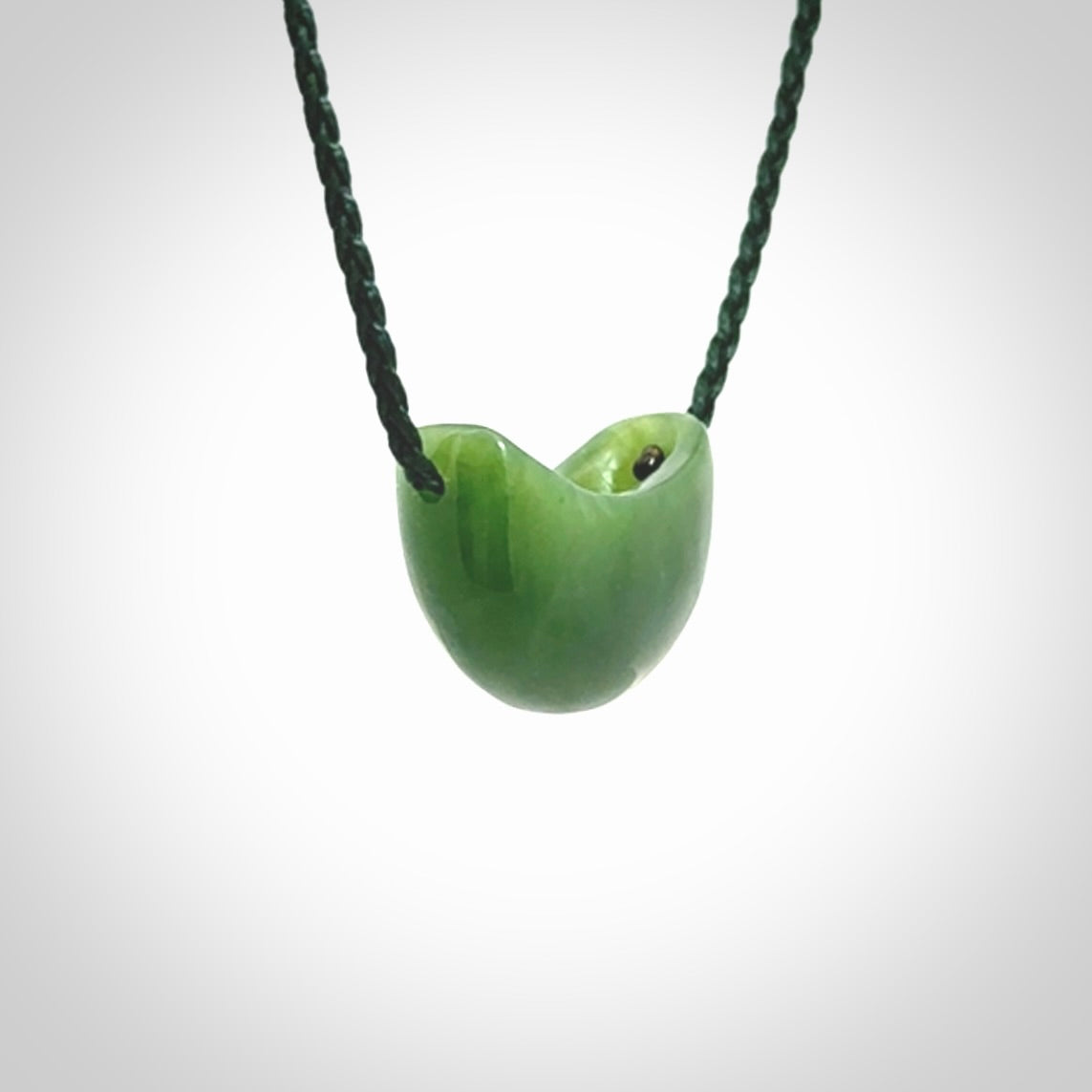 Hand carved jade kete pendant. Kete hand made in British Columbian Jade with adjustable cord. Delivered with Express Courier.