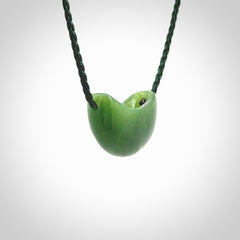 Hand carved jade kete pendant. Kete hand made in British Columbian Jade with adjustable cord. Delivered with Express Courier.