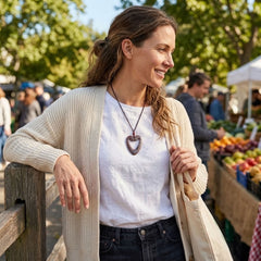 Woman wearing jasper heart pendant