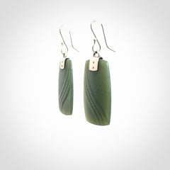 These are stunning large drop jade earrings carved in New Zealand by Josey Coyle. It is carved from a deep green piece of New Zealand Jade and with Sterling Silver hooks and findings.
