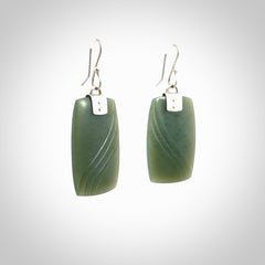 These are stunning large drop jade earrings carved in New Zealand by Josey Coyle. It is carved from a deep green piece of New Zealand Jade and with Sterling Silver hooks and findings.