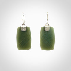 These are stunning large drop jade earrings carved in New Zealand by Josey Coyle. It is carved from a deep green piece of New Zealand Jade and with Sterling Silver hooks and findings.