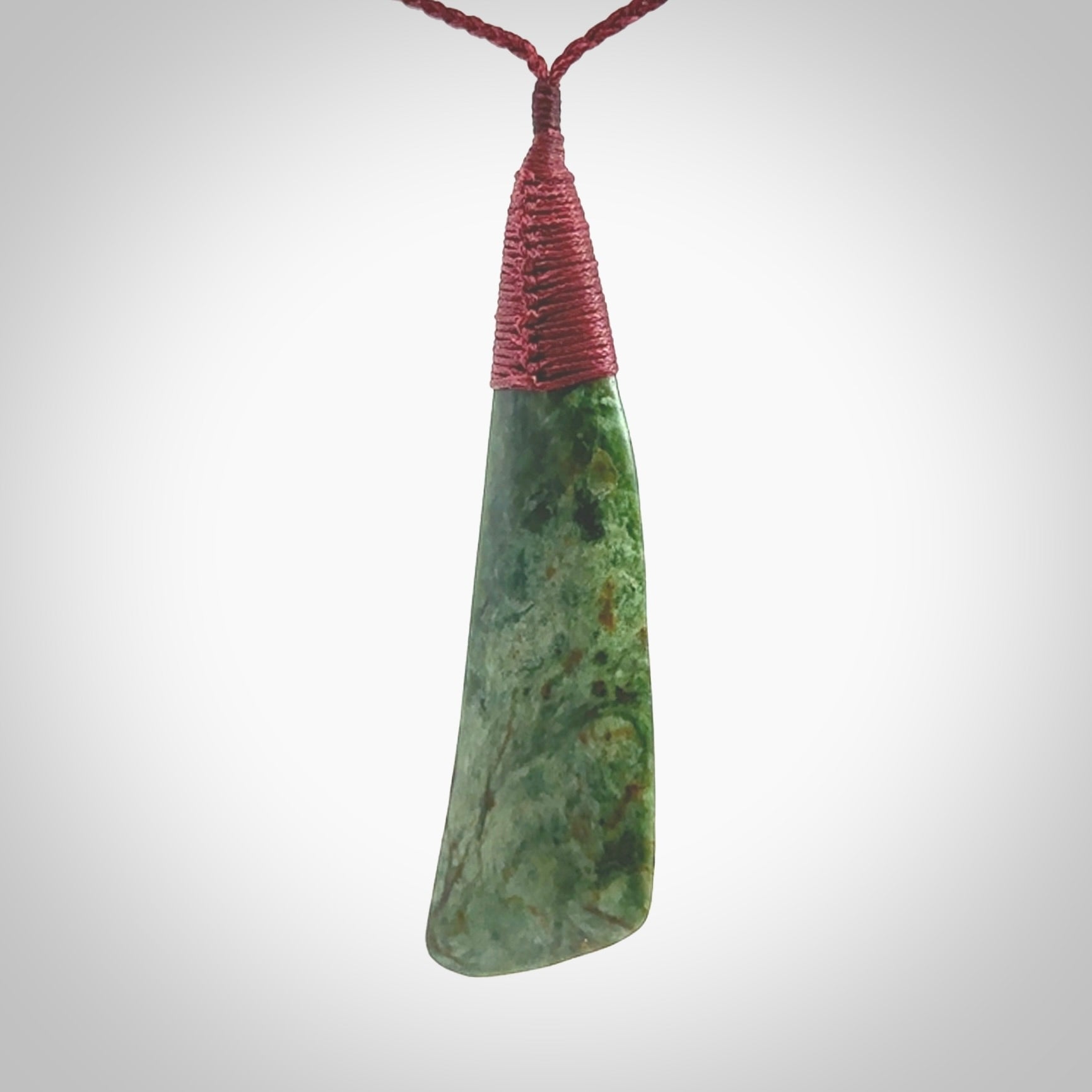 One only larger sized New Zealand jade drop pendant. Hand carved in New Zealand by Ric Moor, jade artist, for NZ Pacific. Provided with plum adjustable cord.