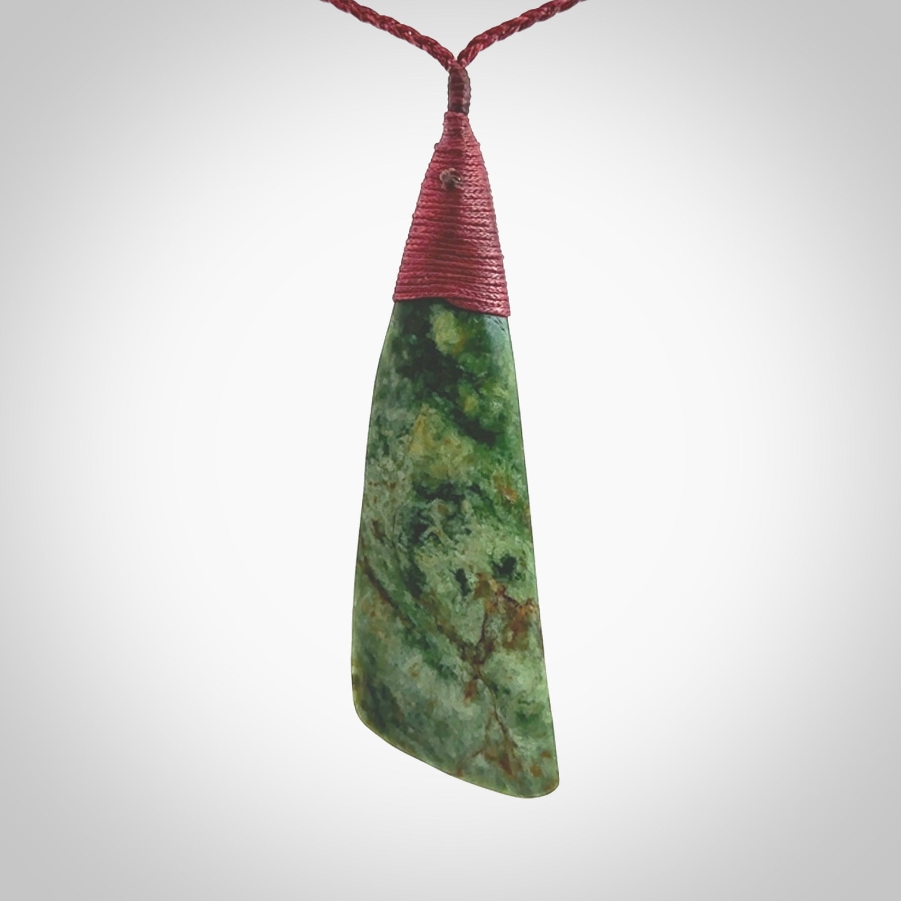 One only larger sized New Zealand jade drop pendant. Hand carved in New Zealand by Ric Moor, jade artist, for NZ Pacific. Provided with plum adjustable cord.