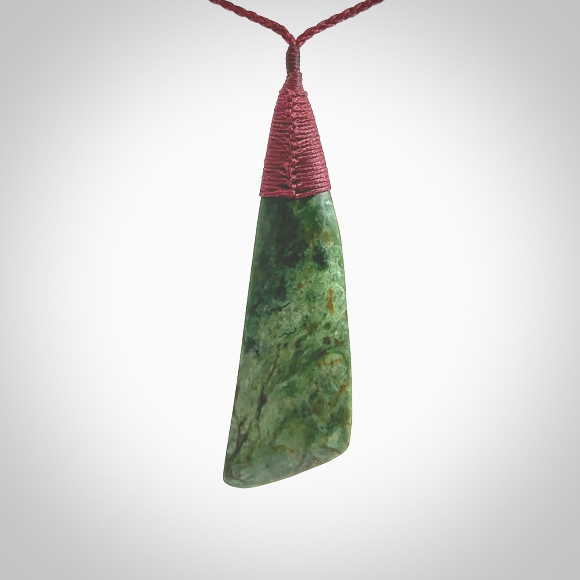 One only larger sized New Zealand jade drop pendant. Hand carved in New Zealand by Ric Moor, jade artist, for NZ Pacific. Provided with plum adjustable cord.