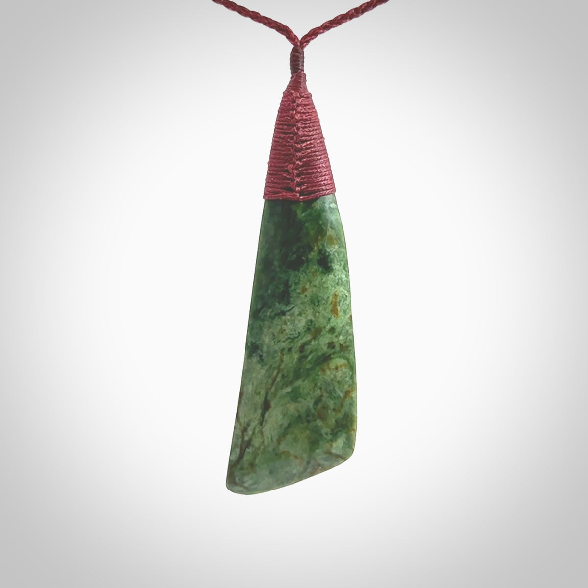 One only larger sized New Zealand jade drop pendant. Hand carved in New Zealand by Ric Moor, jade artist, for NZ Pacific. Provided with plum adjustable cord.