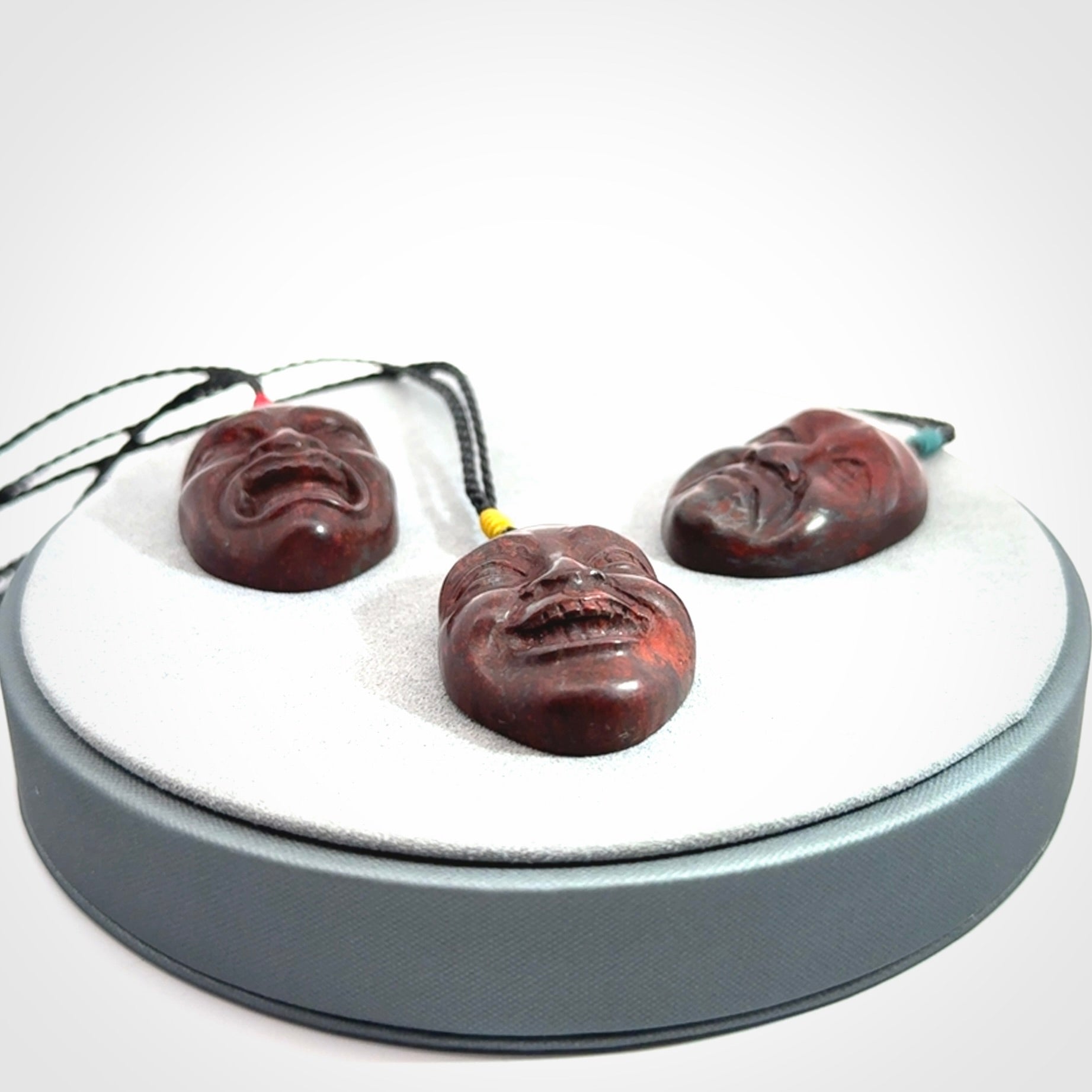 Hand carved jasper stone happy, sad and angry face pendants