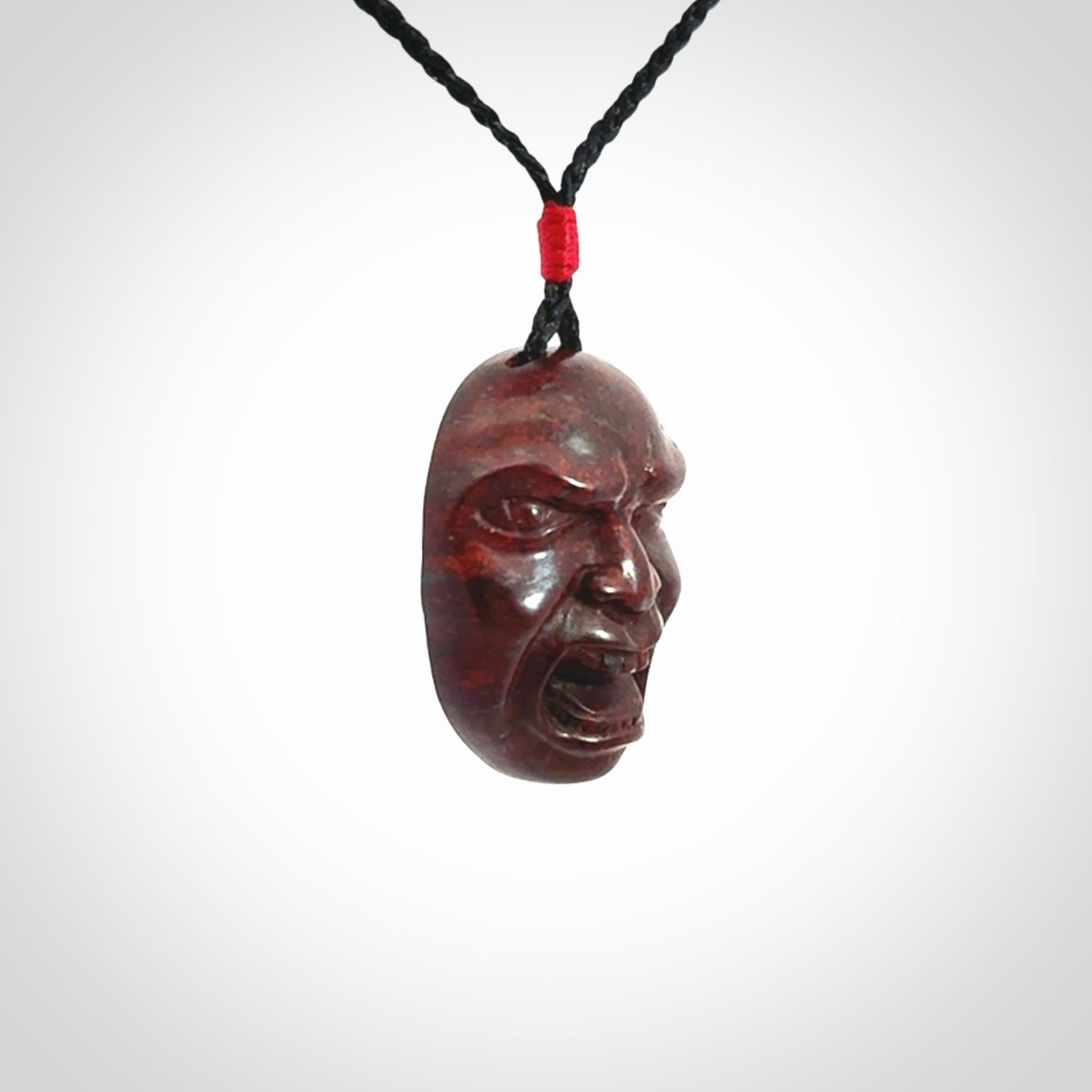 Hand carved jasper stone happy, sad and angry face pendants